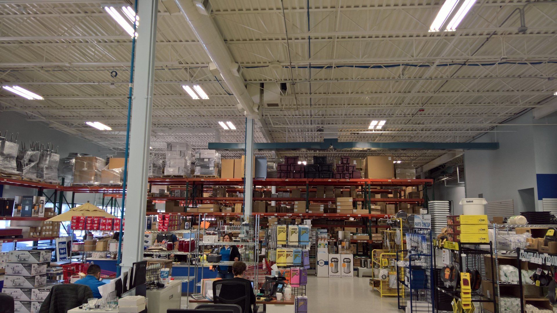 A large warehouse filled with lots of boxes and shelves