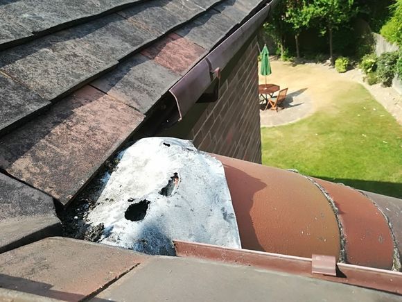 tiled roof and white guttering