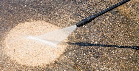 pressure washing in progress