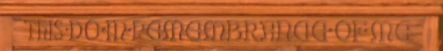 Text carved into a brown surface: 
