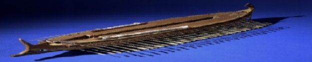 A bronze-colored ancient ship sits on a blue gradient background, possibly representing water.