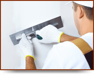 A man plastering the wall