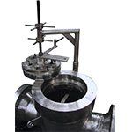 A close up of a metal pipe with a machine attached to it.