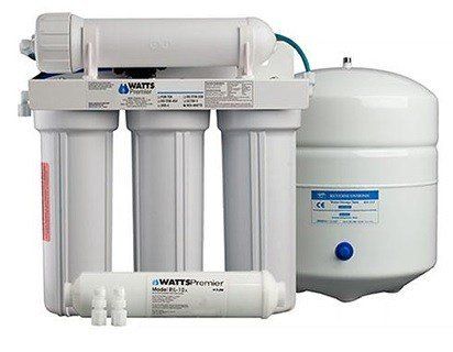 A water filter is sitting next to a tank on a white background.