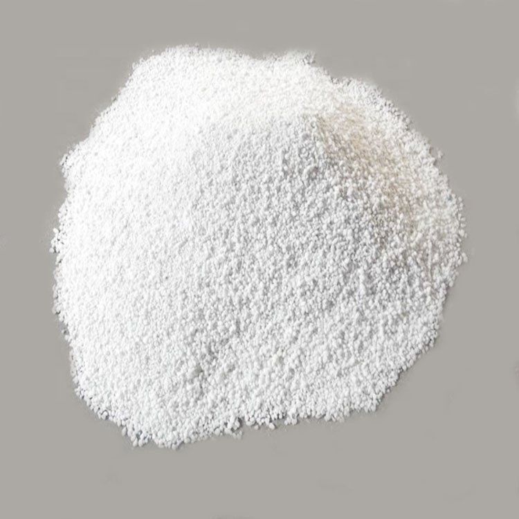 A pile of white powder on a gray surface.