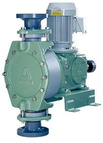 A green pump with a motor attached to it.
