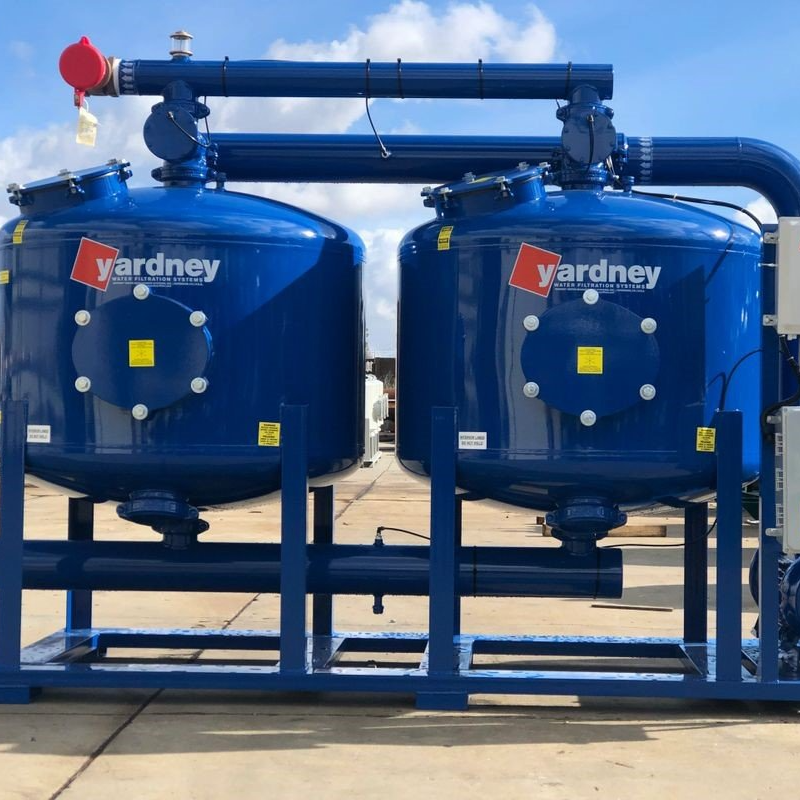 Two large blue tanks with yardney written on them