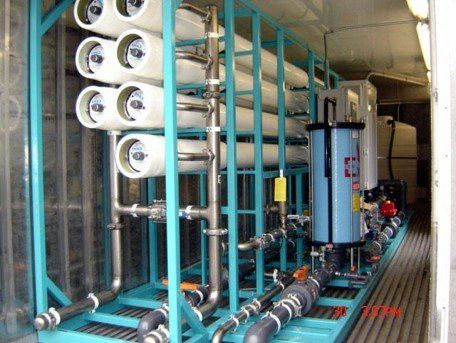 A row of white pipes are lined up on a blue frame