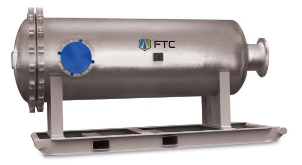 A large stainless steel tank with ftc written on it