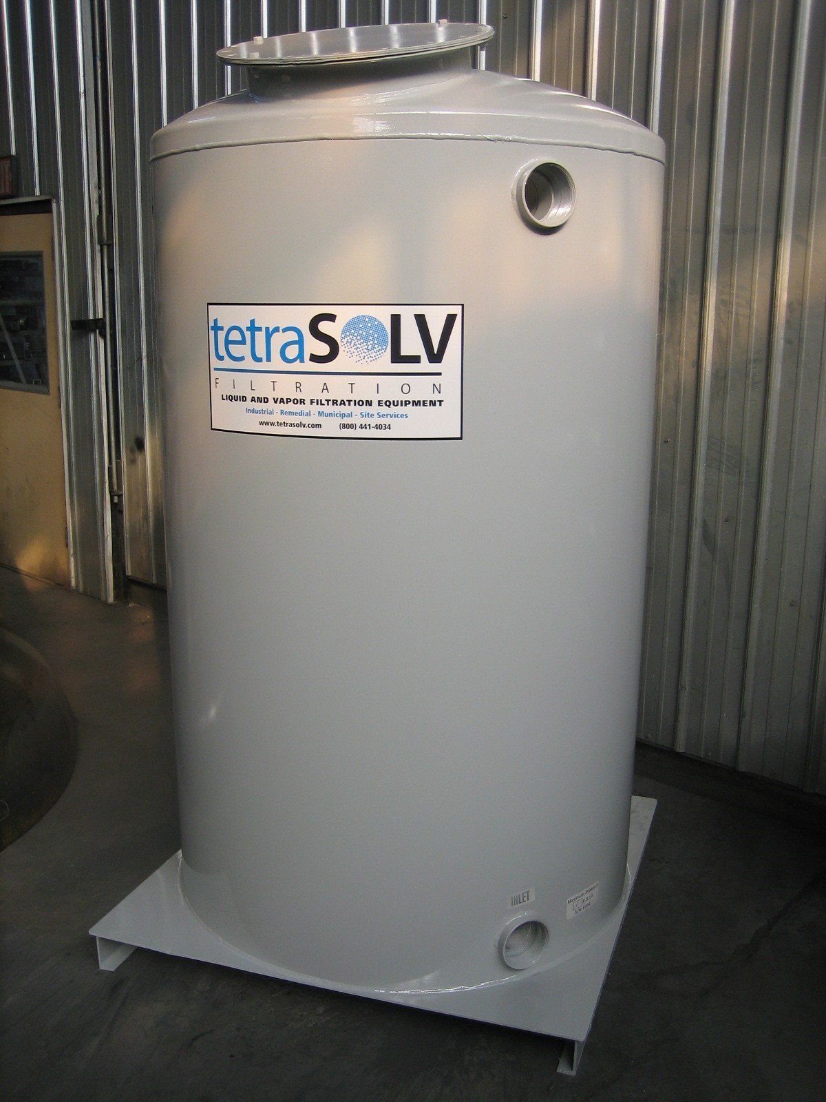 A large white tank with tetrasolv written on it