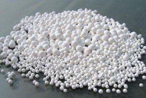 A pile of white beads on a table.