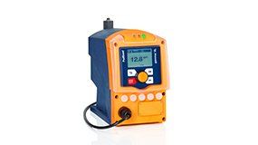 A blue and orange device with a screen on it is sitting on a white surface.