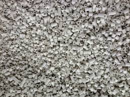 A pile of white beads with holes in them.