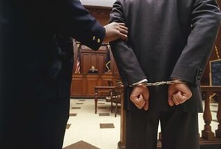 Man Handcuffed — Criminal attorney in Portland, ME Man Handcuffed — Criminal attorney in Portland, ME