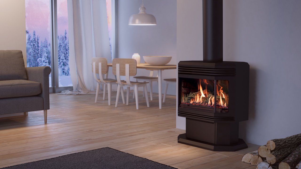 A dark-colored fireplace with flames burning brightly inside a modern living room. Snow visible outside window.