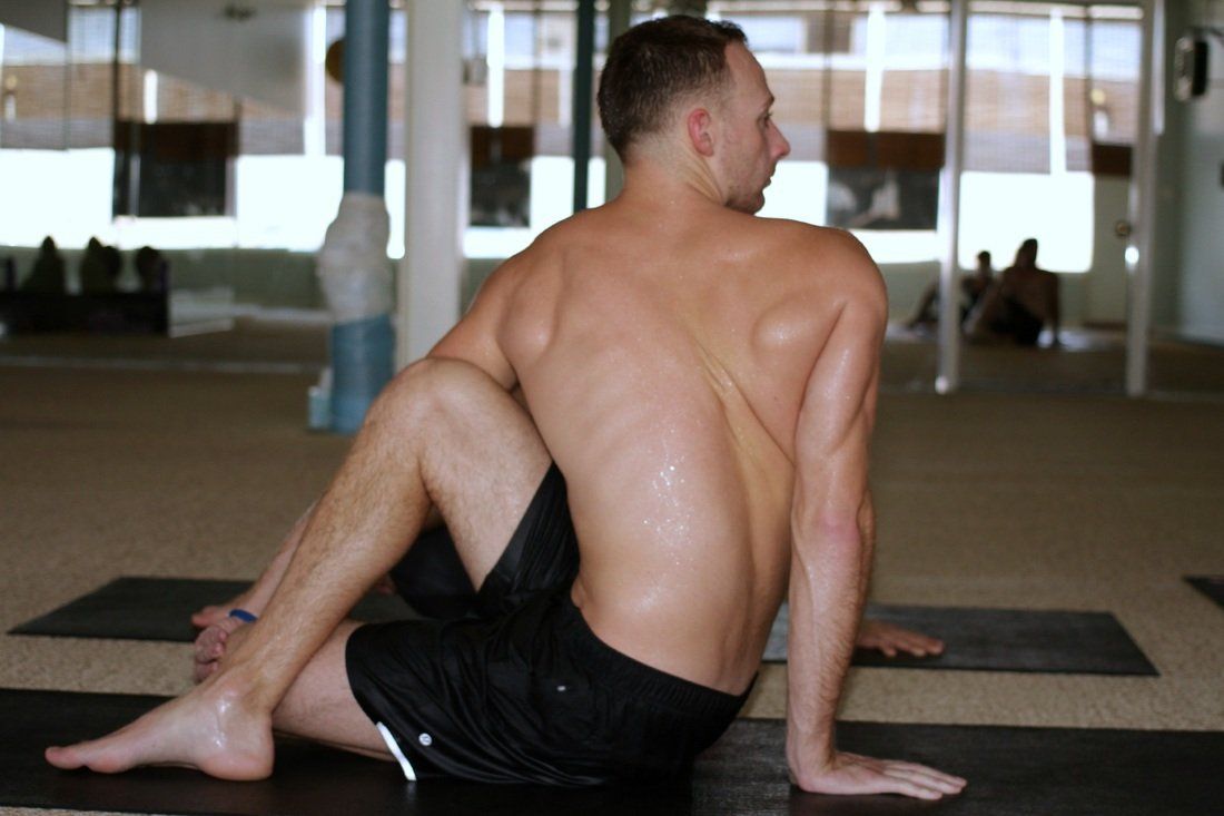 tommy doing bikram hot yoga in carle place, near garden city