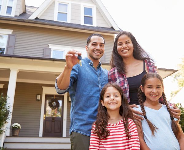Happy Family With Their New House — Merrick, NY — On Point Land Services Corporation
