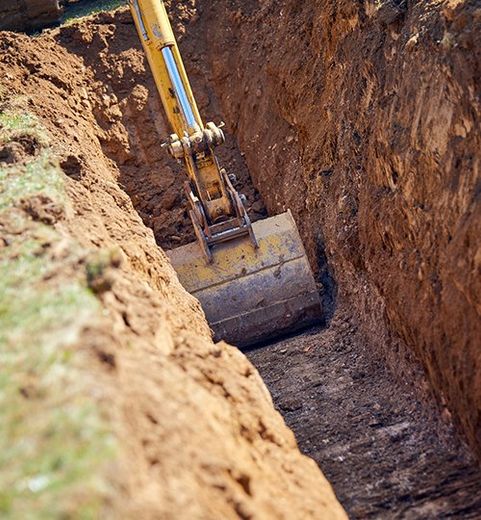 Backhoe Digs the Foundation for Water Pipes — Athens, MI — AAA Sanitation