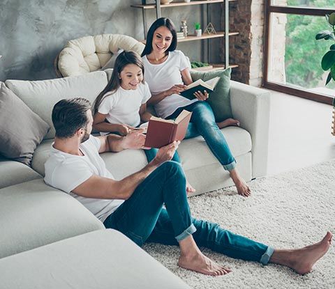 Happy Family on Living Room | Shingle Springs, CA | 49er Termite & Pest Control Happy Family on Living Room | Shingle Springs, CA | 49er Termite & Pest Control