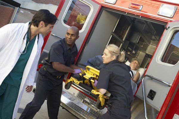 The paramedics and doctor in an emergency situation