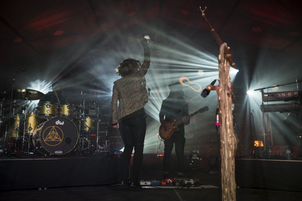 A group of people are playing instruments on a stage.