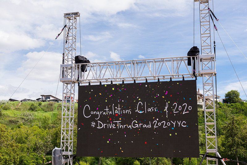 A large screen with the words congratulations class of 2020 on it