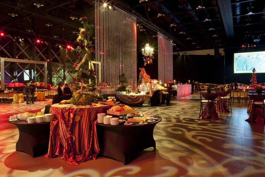 A large room with tables and chairs set up for a party.