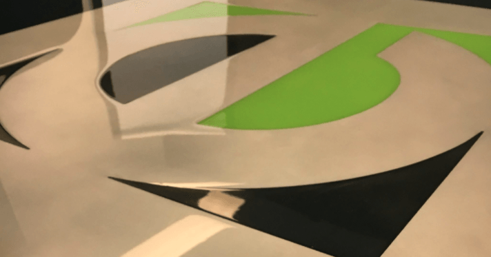 A close up of a painting with a green circle in the middle