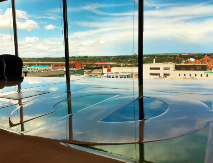 A large glass table with a view of a city
