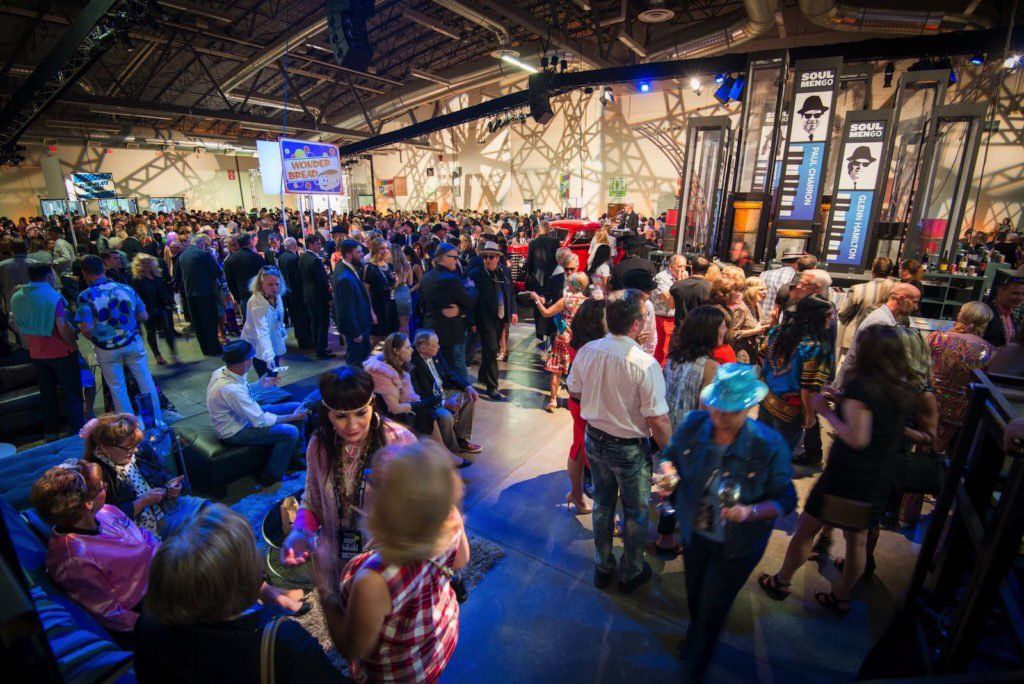 A large group of people are gathered in a large room.