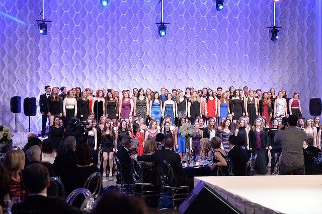 A large group of people are standing on a stage.