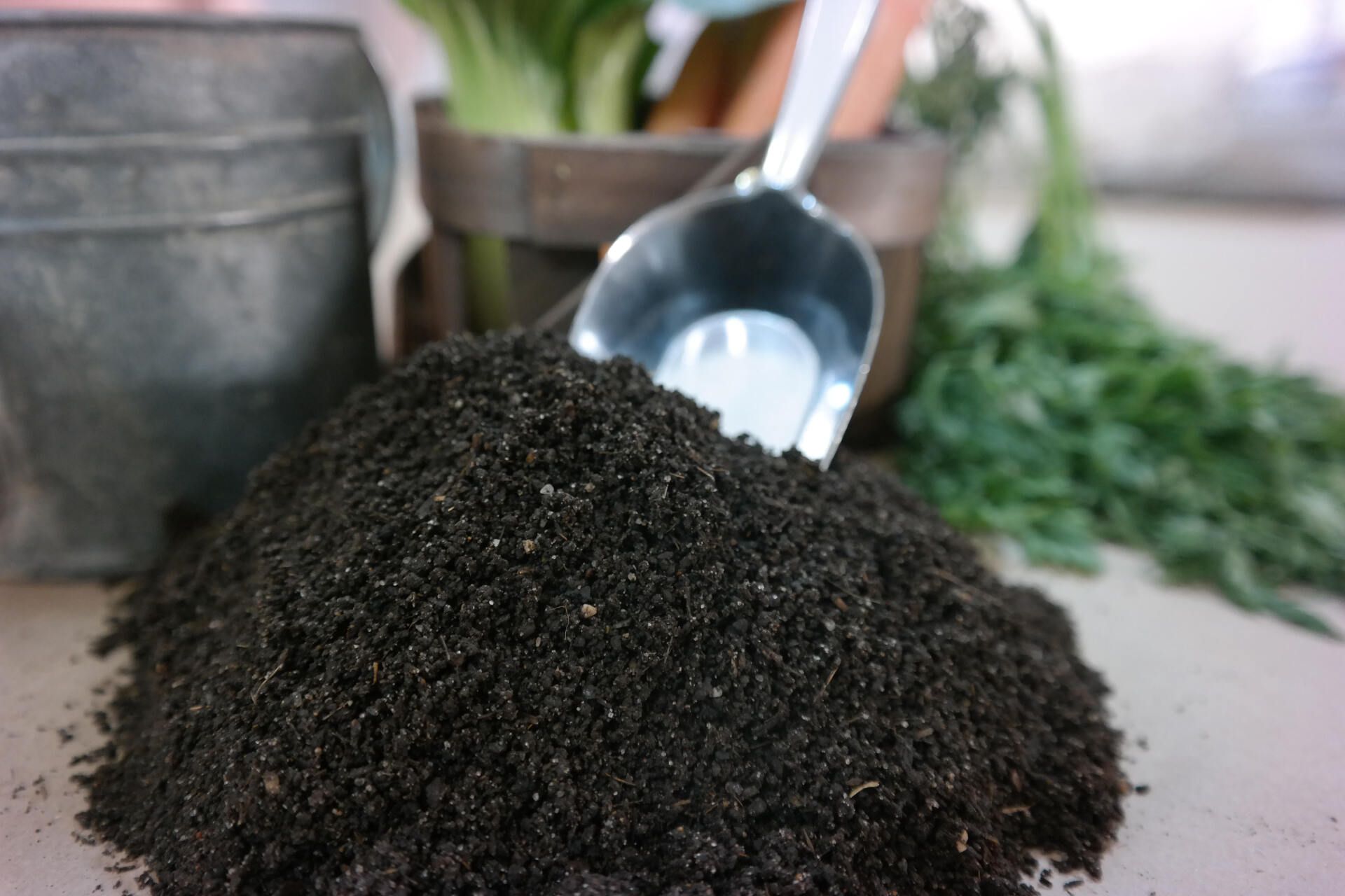 a pile of dirt with a scoop on top of it
