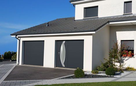 Porte de garage double box avec accès pietons réalisation Trihome