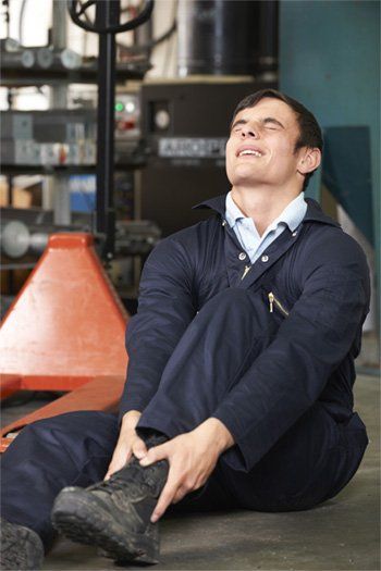 Individual suffering from foot pain