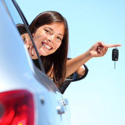 A woman looking outside the car