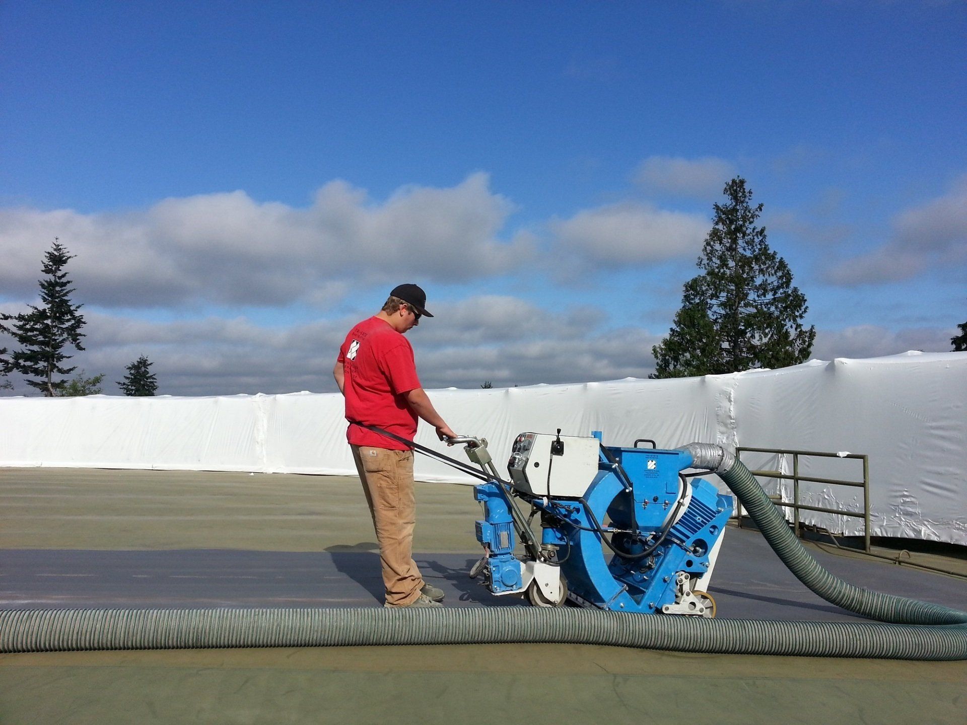 worker using shotblasting machine on concrete in Oregon City, OR