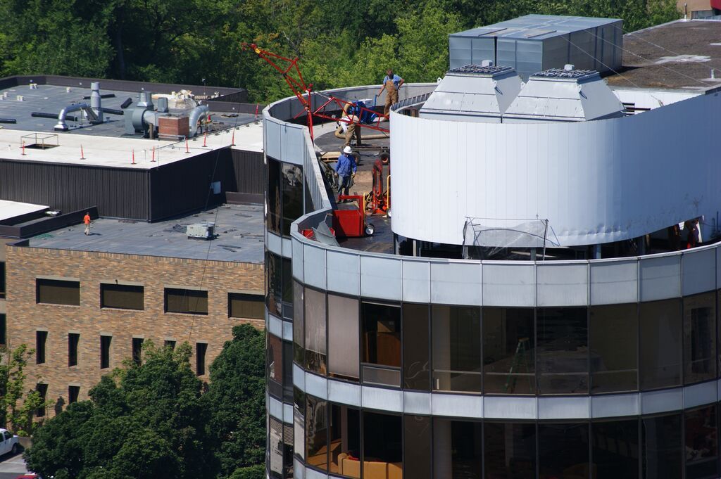 workers on roof of building doing shotblasting in Oregon City, OR