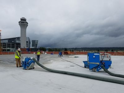 worker doing shotblasting on a roof in Oregon City, OR