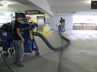 worker operating a shotblasting machine in Oregon City, OR