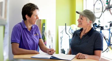 Fitness instructor talking to a client