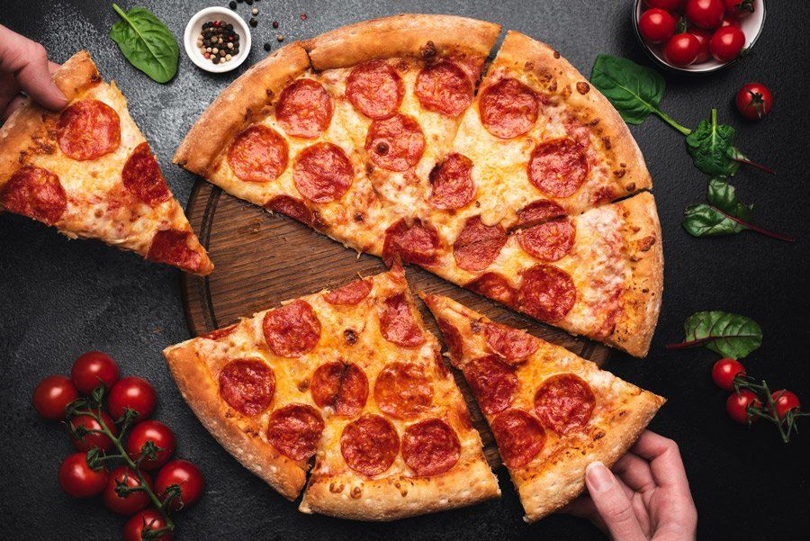 Picking Slice Of Pepperoni Pizza — Bradenton, FL — San Remo Pizza & Pasta Picking Slice Of Pepperoni Pizza — Bradenton, FL — San Remo Pizza & Pasta