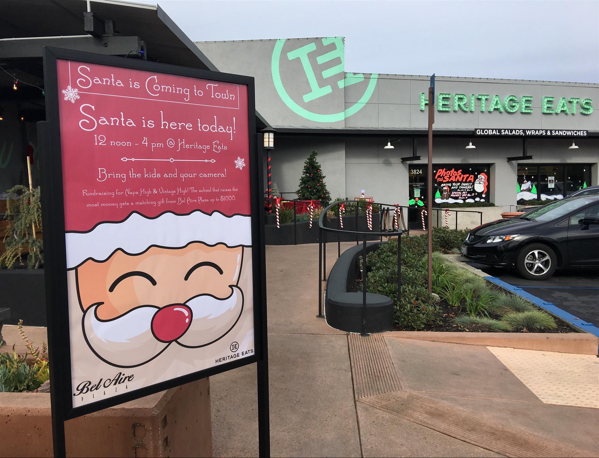 A sign in front of a building that says heritage eats