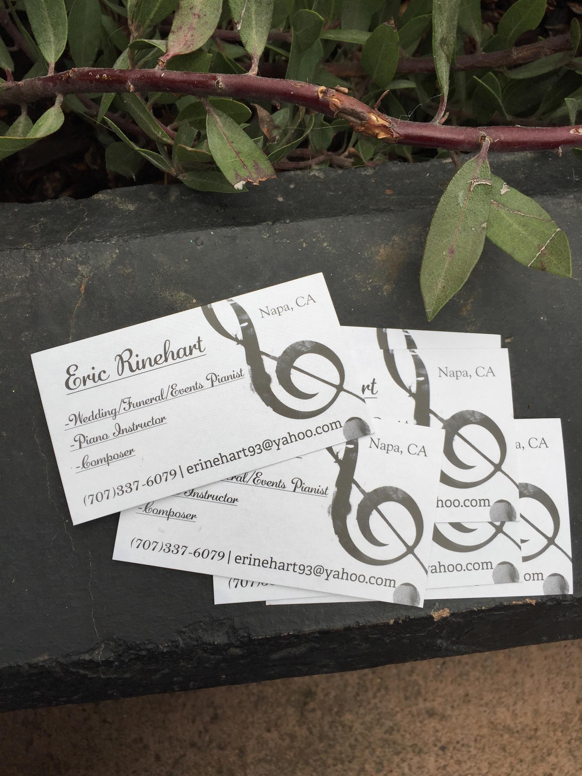 A stack of business cards with the name eric rinker on them