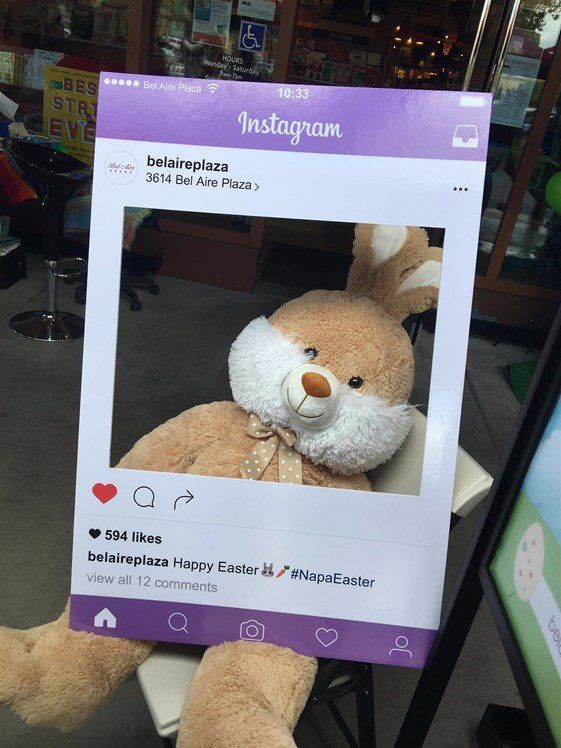 A stuffed bunny is sitting in front of an instagram frame