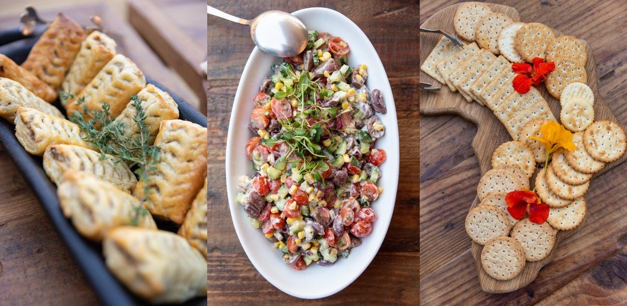 Assorted vegan dishes: stuffed pastries, quinoa salad, and crackers with cheese and tomatoes
