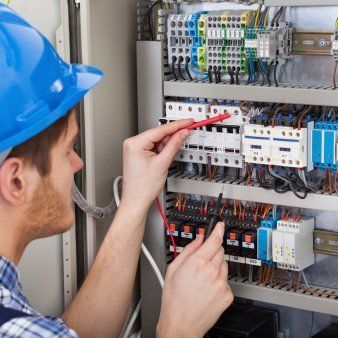 man fixing high voltage board