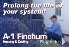 Man working on an HVAC unit, text: 
