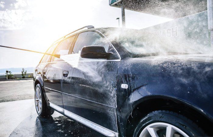 Car Wash Supply — High-pressure Washing Car Outdoors in Lancaster, OH