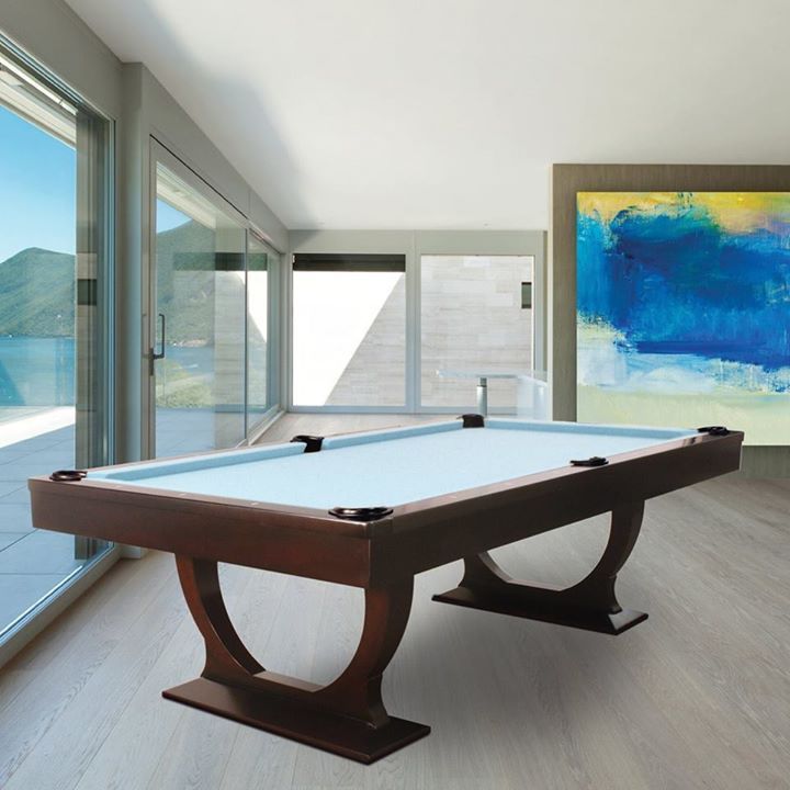 Modern room with a pool table, floor-to-ceiling windows, and a large abstract blue painting.