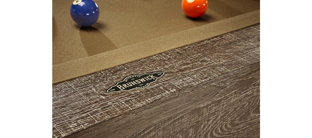 Blue and orange balls near a carpeted floor with a small floor sign